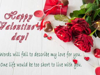 Red roses and chocolate candies for valentines day.